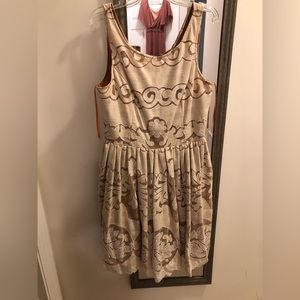 Under skies  cream and gold lace dress